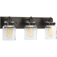 Calhoun Collection Three-Light Antique Bronze Clear Glass Farmhouse Bath Vanity Light - Damp Location Listed