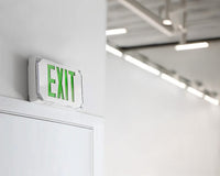 Hazardous Location LED Exit Sign & Emergency Light - Double Face - Gray Housing Color with Green Lettering - 120-277V - with 90 Minute Battery Back-Up